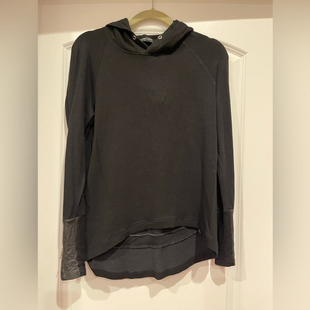 Soft Generation Love top with leather on the sleeves and on the back.